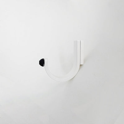 A CBH Charlie Bumper Hook on a white wall.