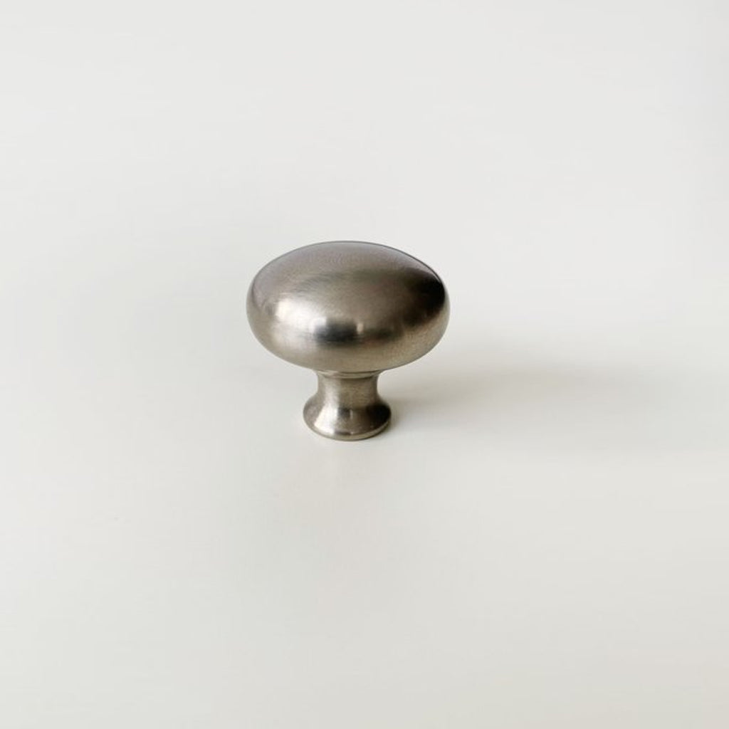 a CBH Charlie Finish Sample metal knob on a white surface.