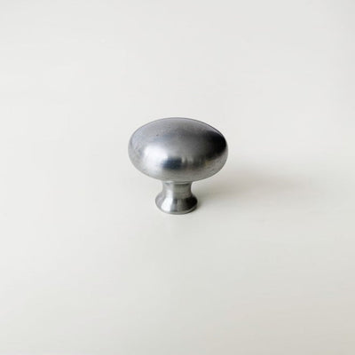 A CBH Charlie Finish Sample metal knob on a white surface.