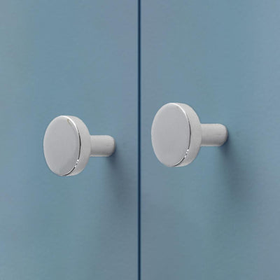 A close up of a door with two CBH Charlie Moon Knobs.