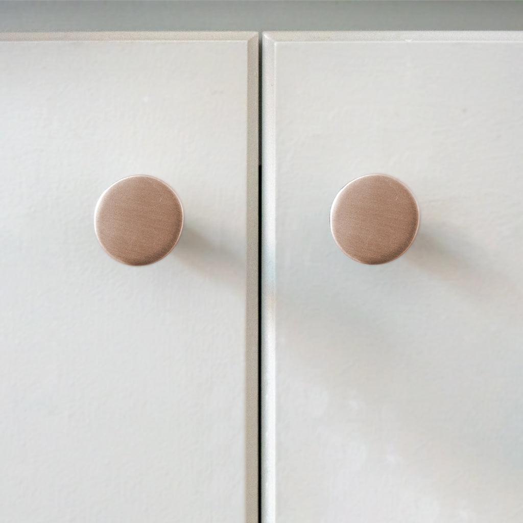 A close up of a door with two CBH Charlie Moon Knobs.