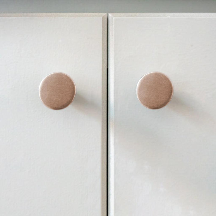 A close up of a door with two CBH Charlie Moon Knobs.