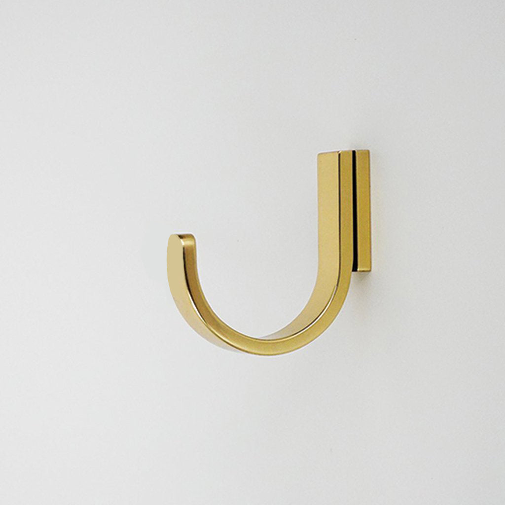 A close up of a CBH Charlie Round Hook on a wall.