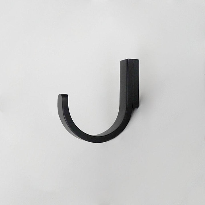 A CBH Charlie Round Hook on a white wall.