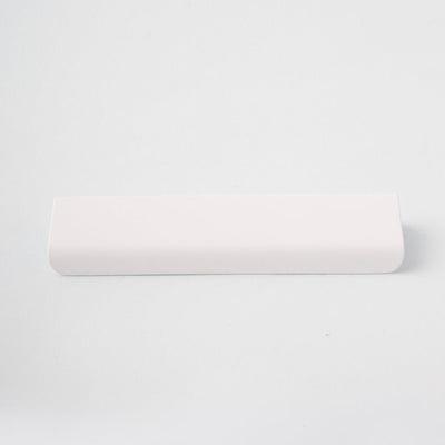 Long white tab pull for cabinets. Simple and minimal hardware. Made in Toronto. From the front. 
