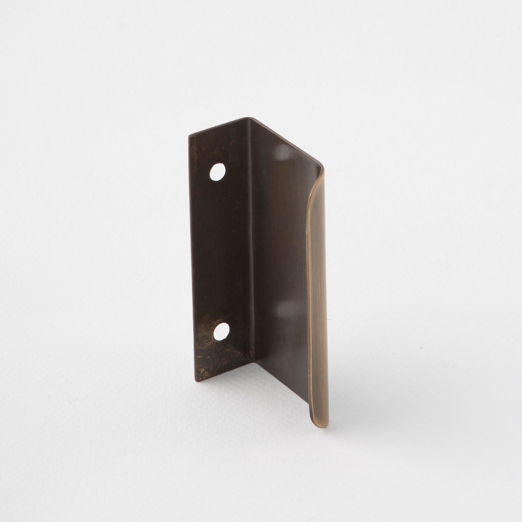 Dark brown tab pull for cabinets. Simple and minimal hardware. Made in Toronto.