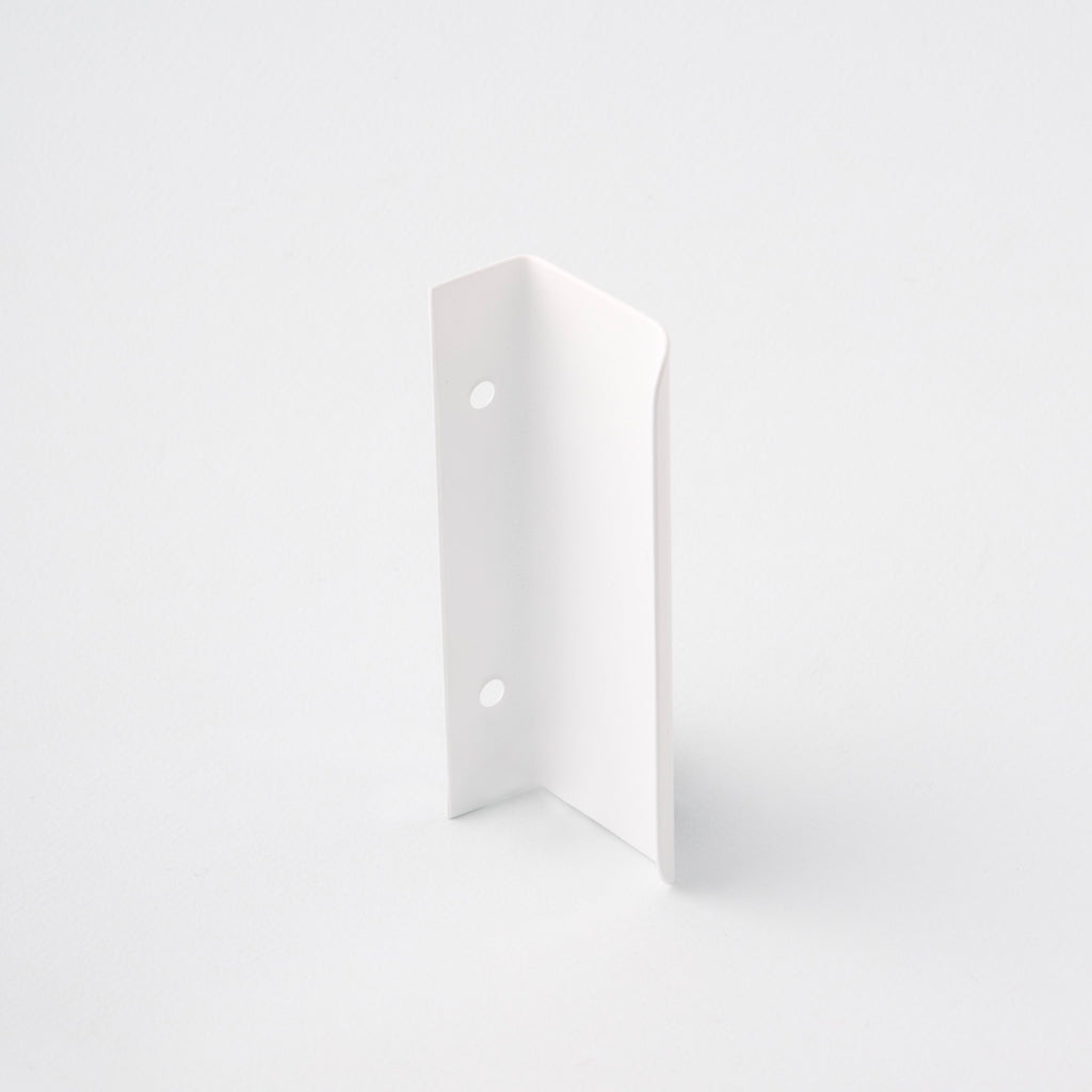 Short white tab pull for cabinets. Simple and minimal hardware. Made in Toronto. From the back. 
