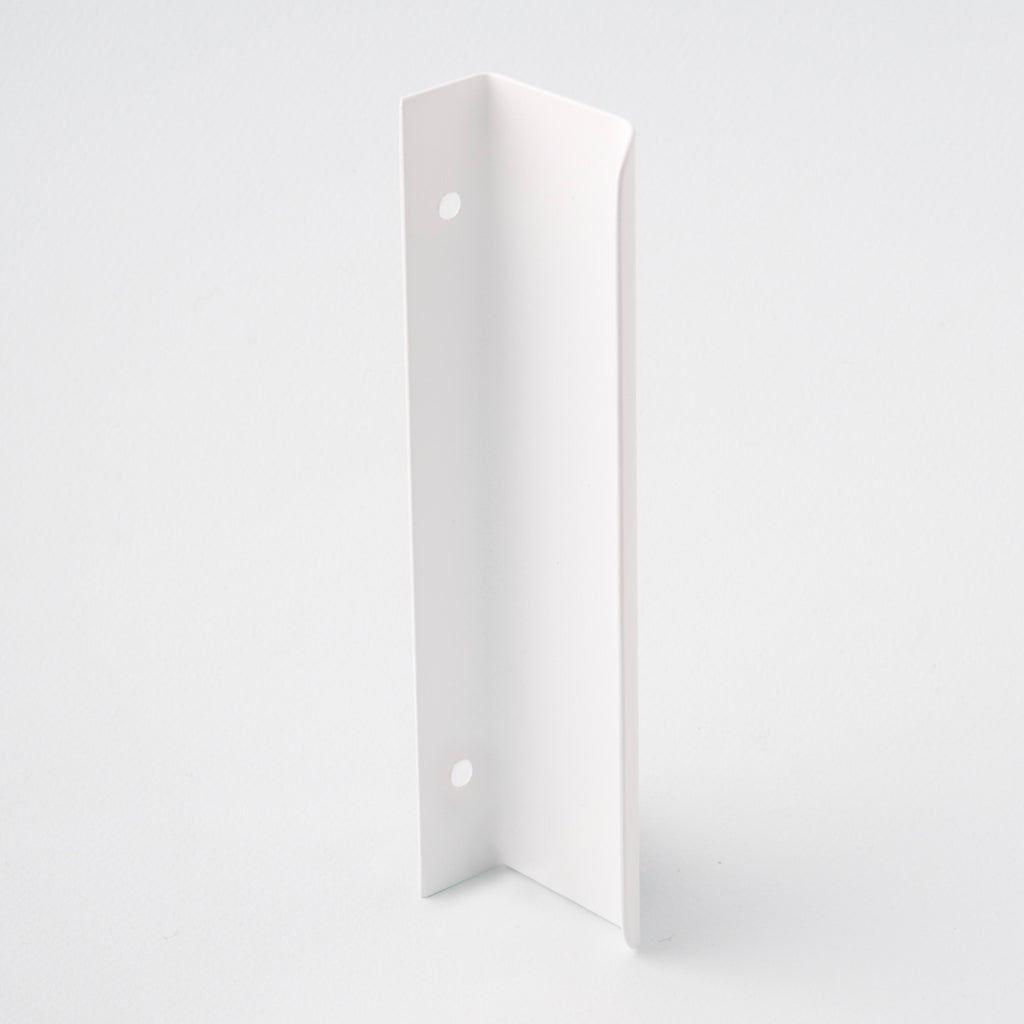 Long white tab pull for cabinets. Simple and minimal hardware. Made in Toronto. From the back. 