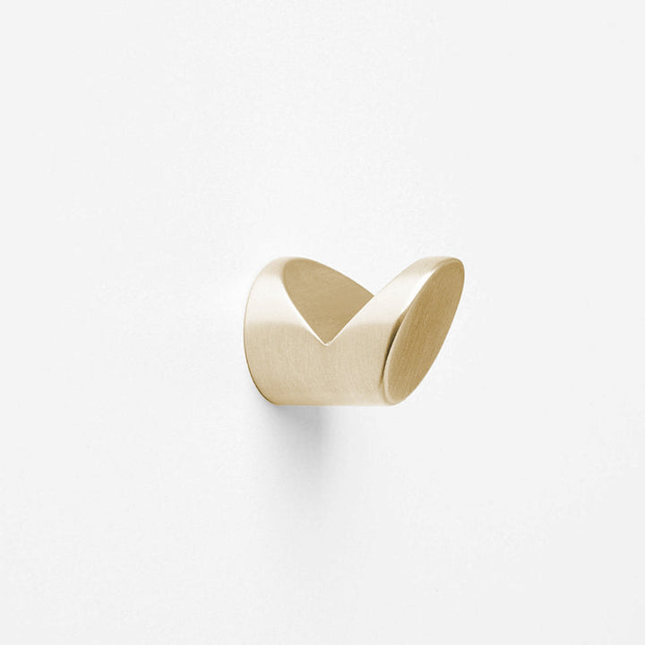 A CBH Charlie Wedge Hook on a white wall.