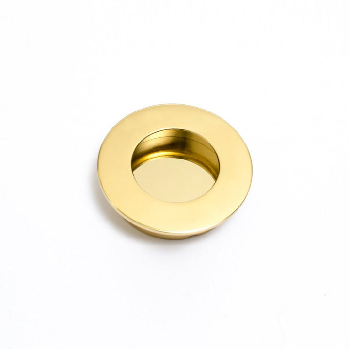 A Baccman Berglund Circle Flush Handle on a white background.