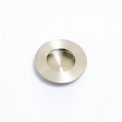 A Baccman Berglund Circle Flush Handle on a white background.