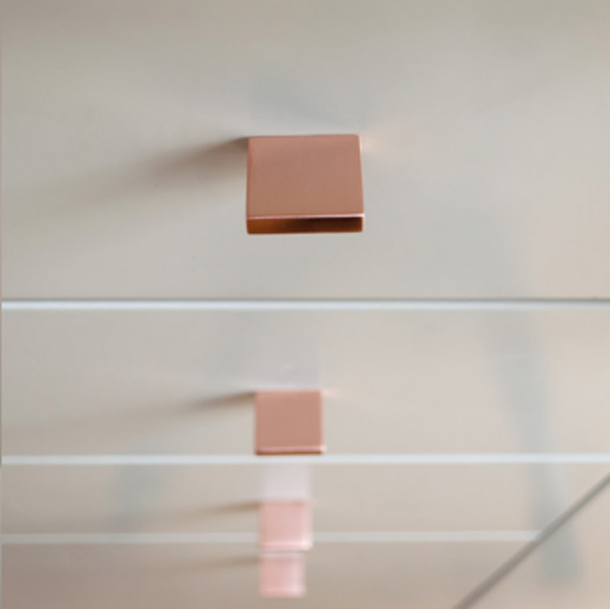 Square knob pull in polished copper. Modern and minimal.