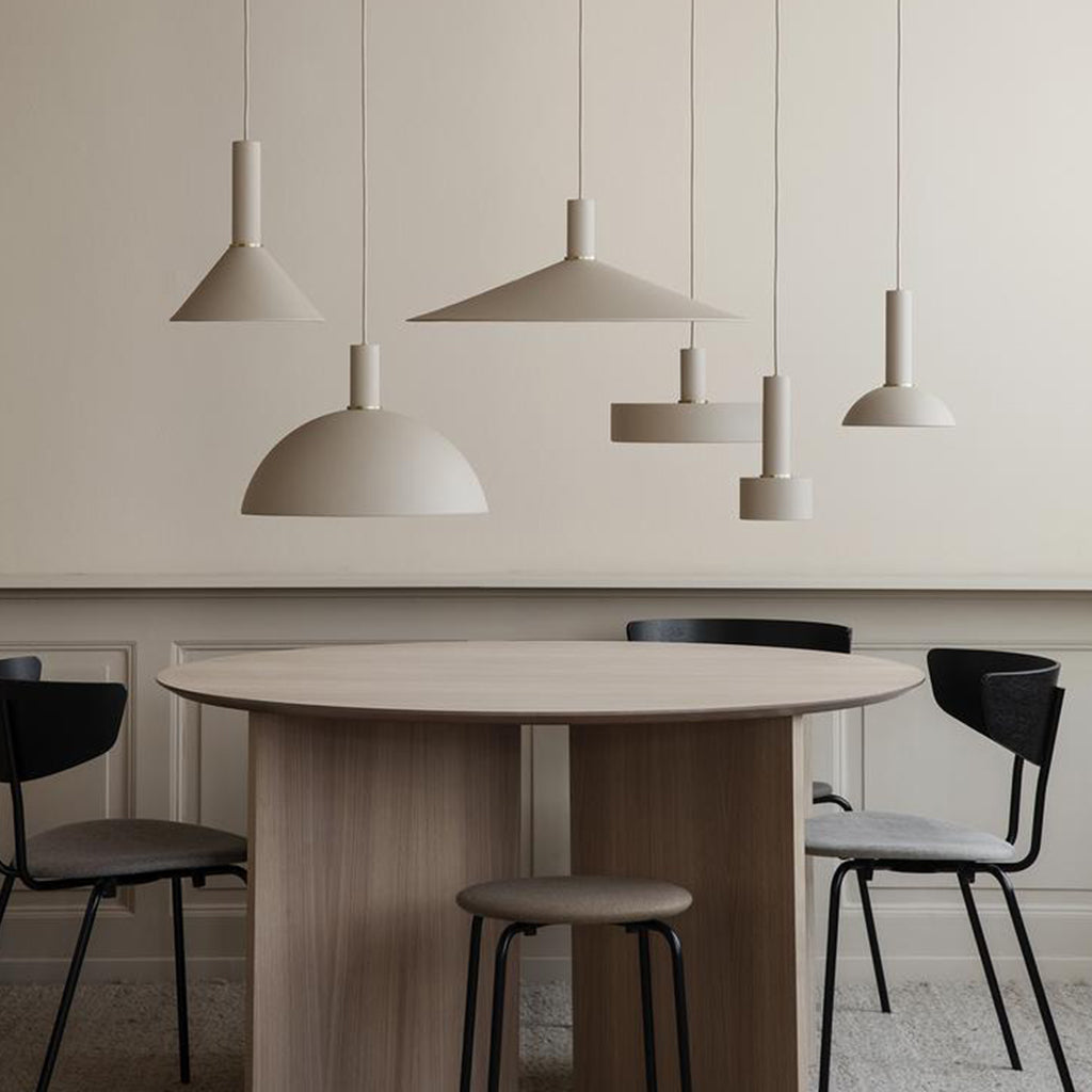 A dining room with a Ferm Living Collect Angle Shade table and chairs.