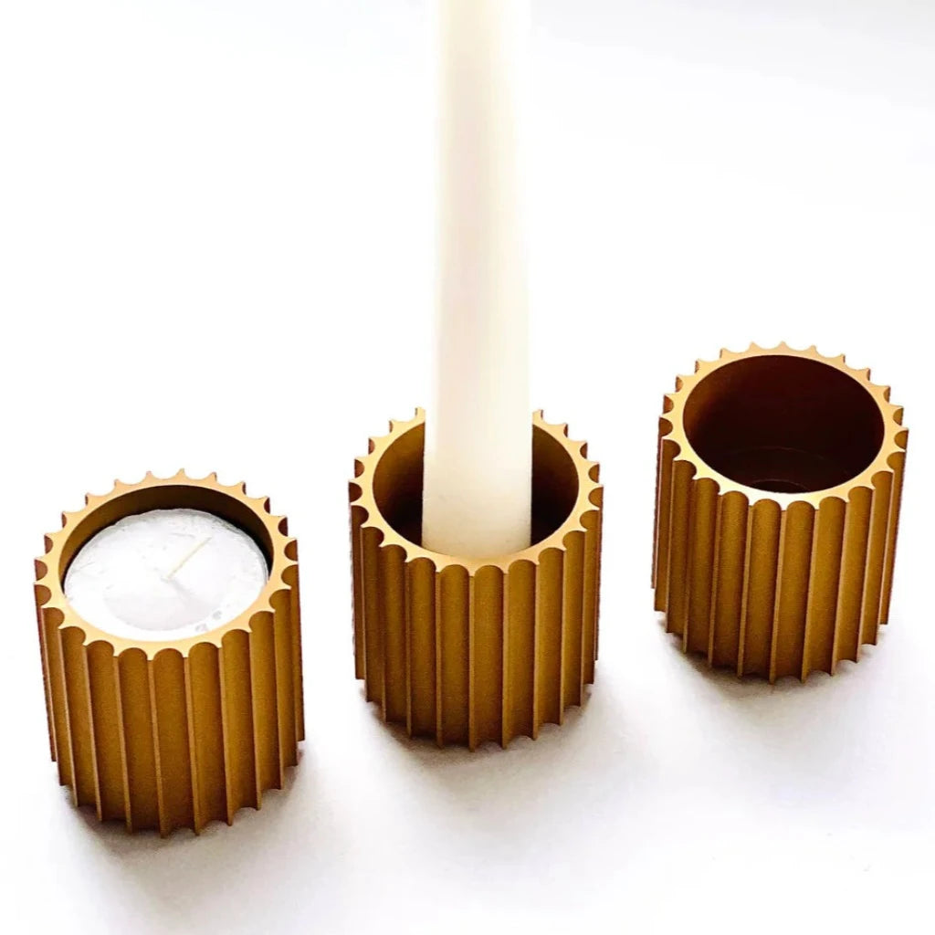 Column Candle Holders by Object/Interface with a tapered candle and a tea light in it