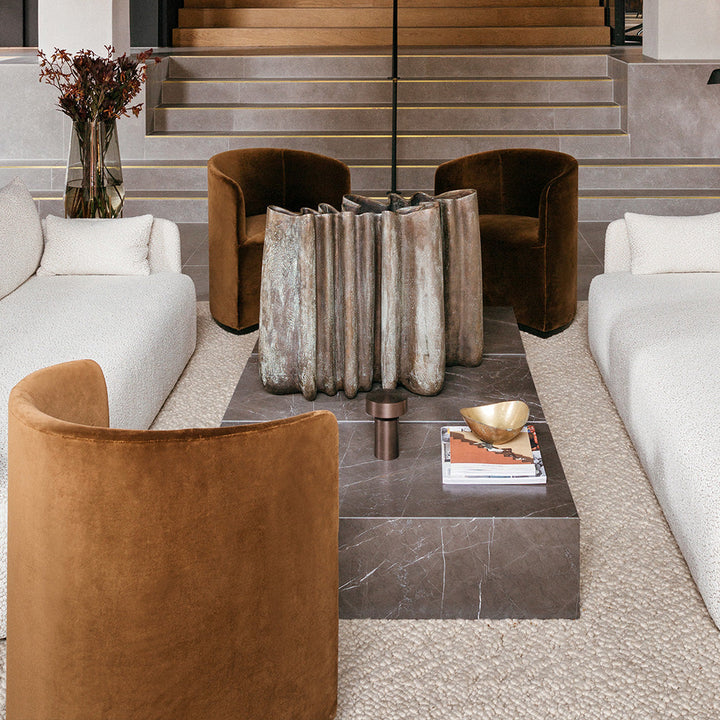 A living room filled with Audo's furniture and a fire place is lit up by the Column LED Table Lamp.