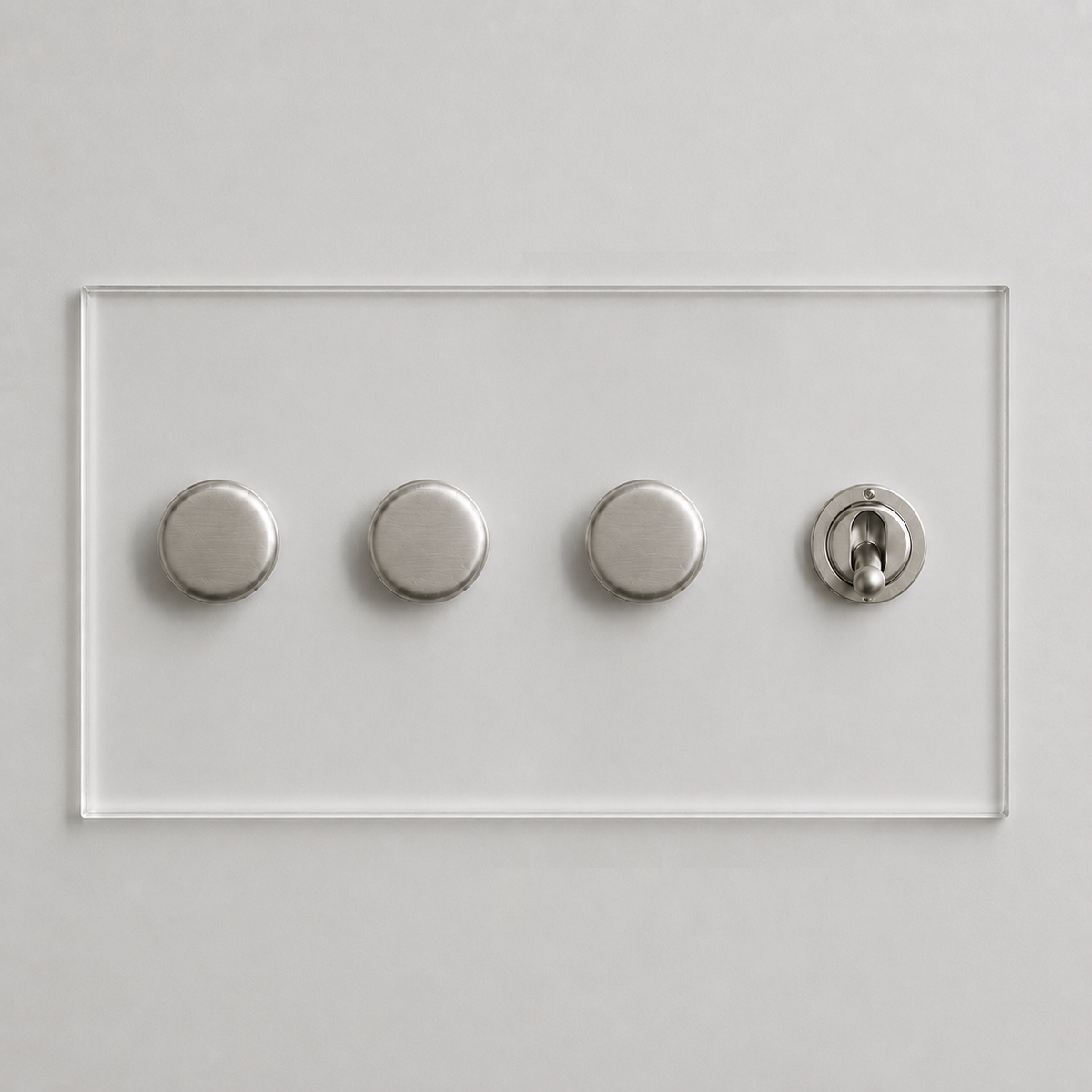 Forbes & Lomax invisible acrylic plate with three brushed nickel rotary dimmers and one matching toggle switch.