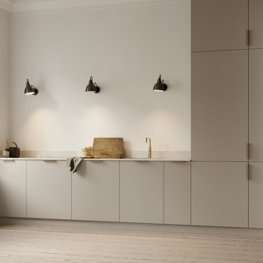 Beige kitchen with matte brass Furnipart Comet edge pulls on the base and tall cabinet doors.