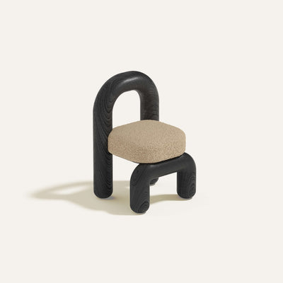 lithic dining chair with black oak frame and beige upholstery