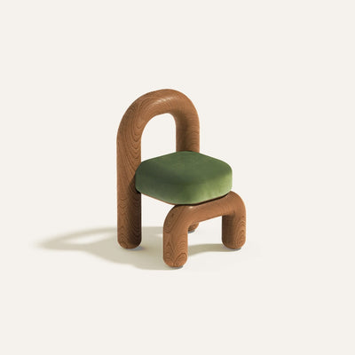 lithic dining chair with red oak frame and green velvet upholstery