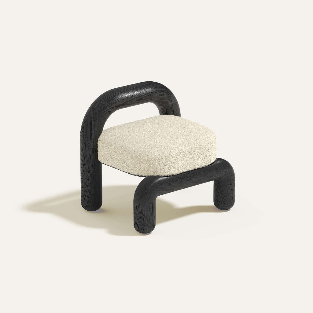 lithic lounge chair with black oak frame and cream upholstery seat