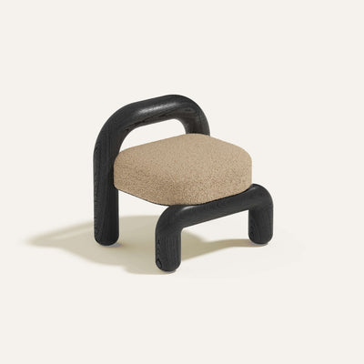lithic lounge chair with black oak frame and beige upholstery