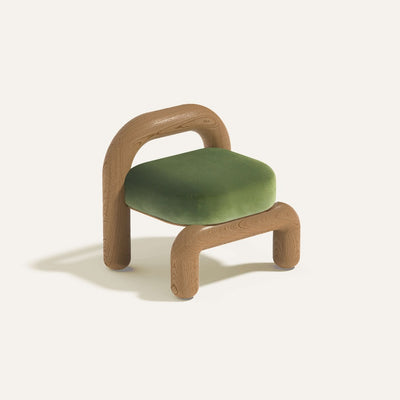 Lithic lounge chair with natural oak frame and green velvet upholstery