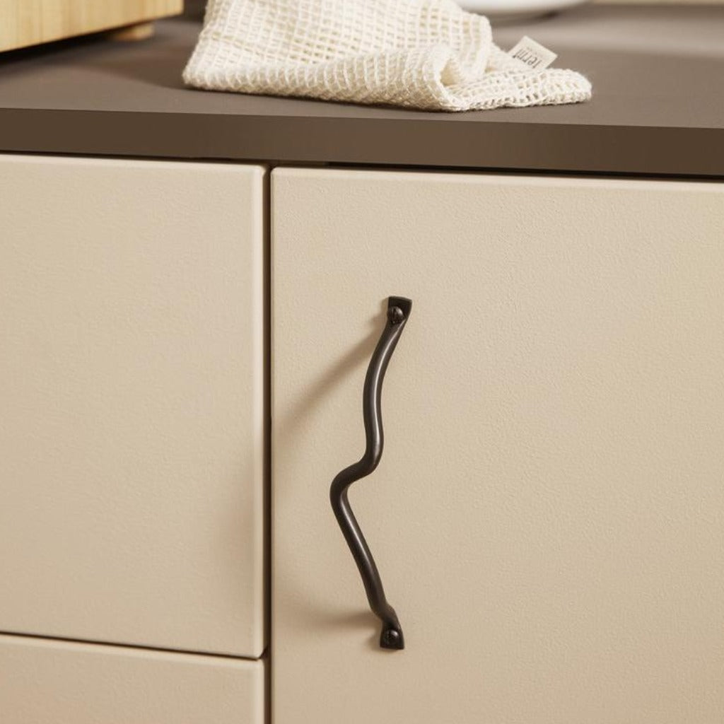 Curvature handles, blackened brass finish, cabinet pull, horizontally mounted.