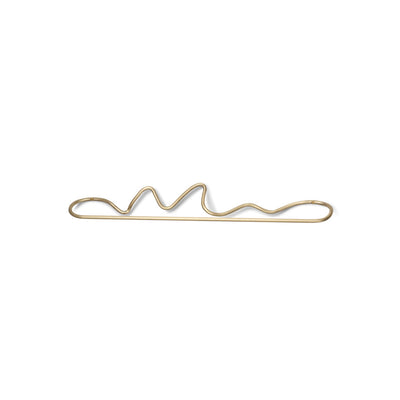 A Ferm Living metal hair clip with a wavy design.