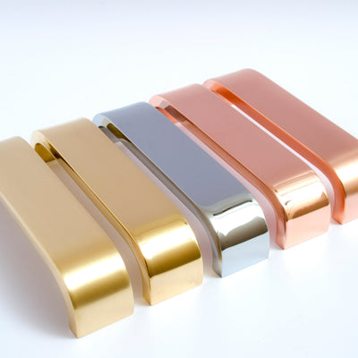 Beautiful solid handles from the Curve series. Brass, copper, and chrome.