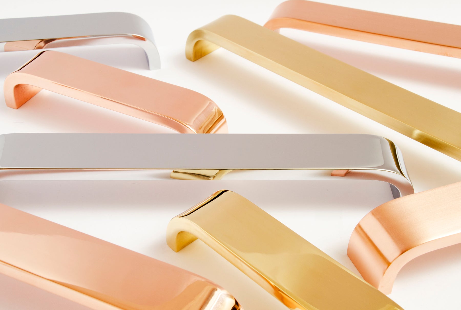 Curved cabinet hardware handles made of brass copper and polished stainless steel