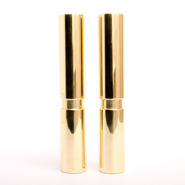 A pair of Hey Legs lipsticks by Baccman Berglund sitting next to each other.