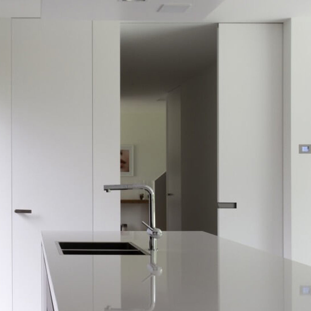 a kitchen with a sink and a Sugatsune DSI 4258 Horizontal Pocket Door Flush Handle counter top.