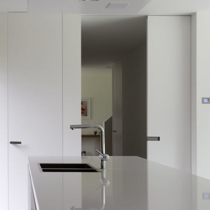 a kitchen with a sink and a Sugatsune DSI 4258 Horizontal Pocket Door Flush Handle counter top.