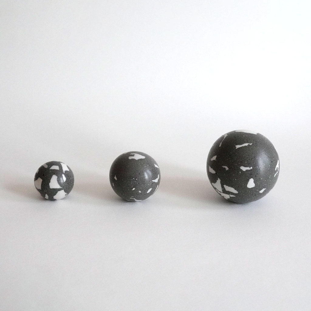 Three Urbi et Orbi Demenico Sphere Knobs on a white surface.