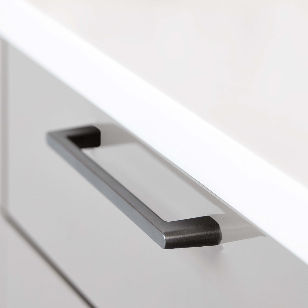 Brushed anthracite Furnipart Diner cabinet handle, 160 mm, on a light grey drawer under a white countertop.