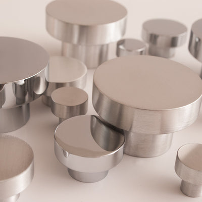 A group of Baccman Berglund Dot Knobs sitting on top of a table.