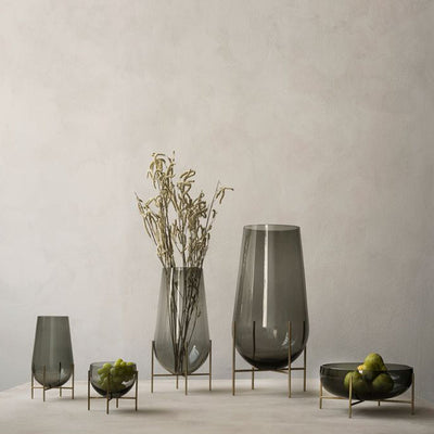 A beautiful arrangement of the Echasse collection together. Smoked glass married perfectly with bronze legs.
