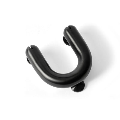 FAT Charcoal Door Knocker flat lay on white background. Designed by Tom Dixon for d line.