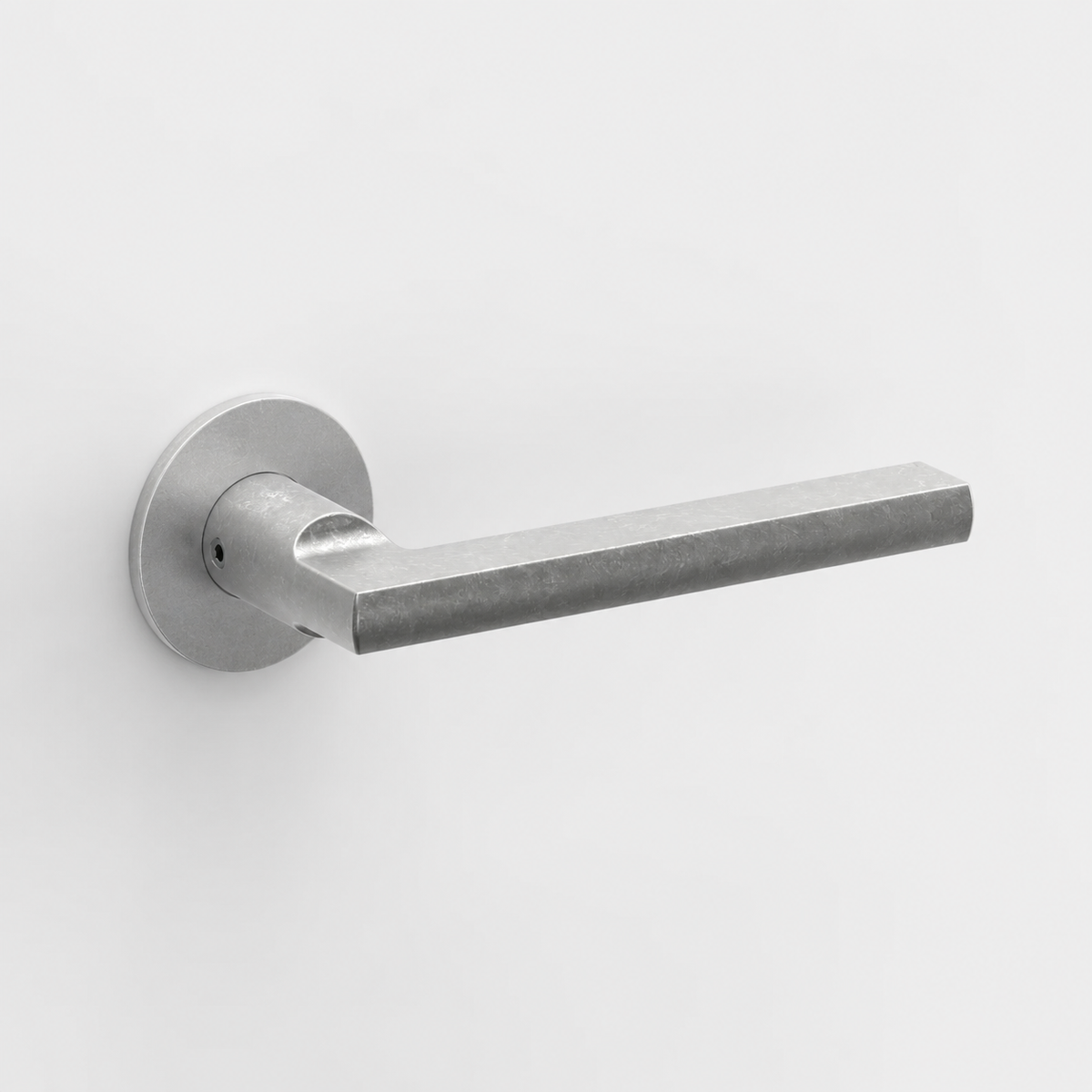 FSB 1035 matte silver door lever with a flat, ergonomic design and circular rose on a clean white background.