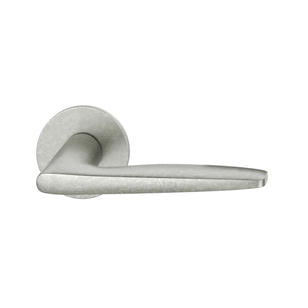 Aluminum pure natural FSB 1058 door lever, a tapered lever with a flowing silhouette, on a round rose.