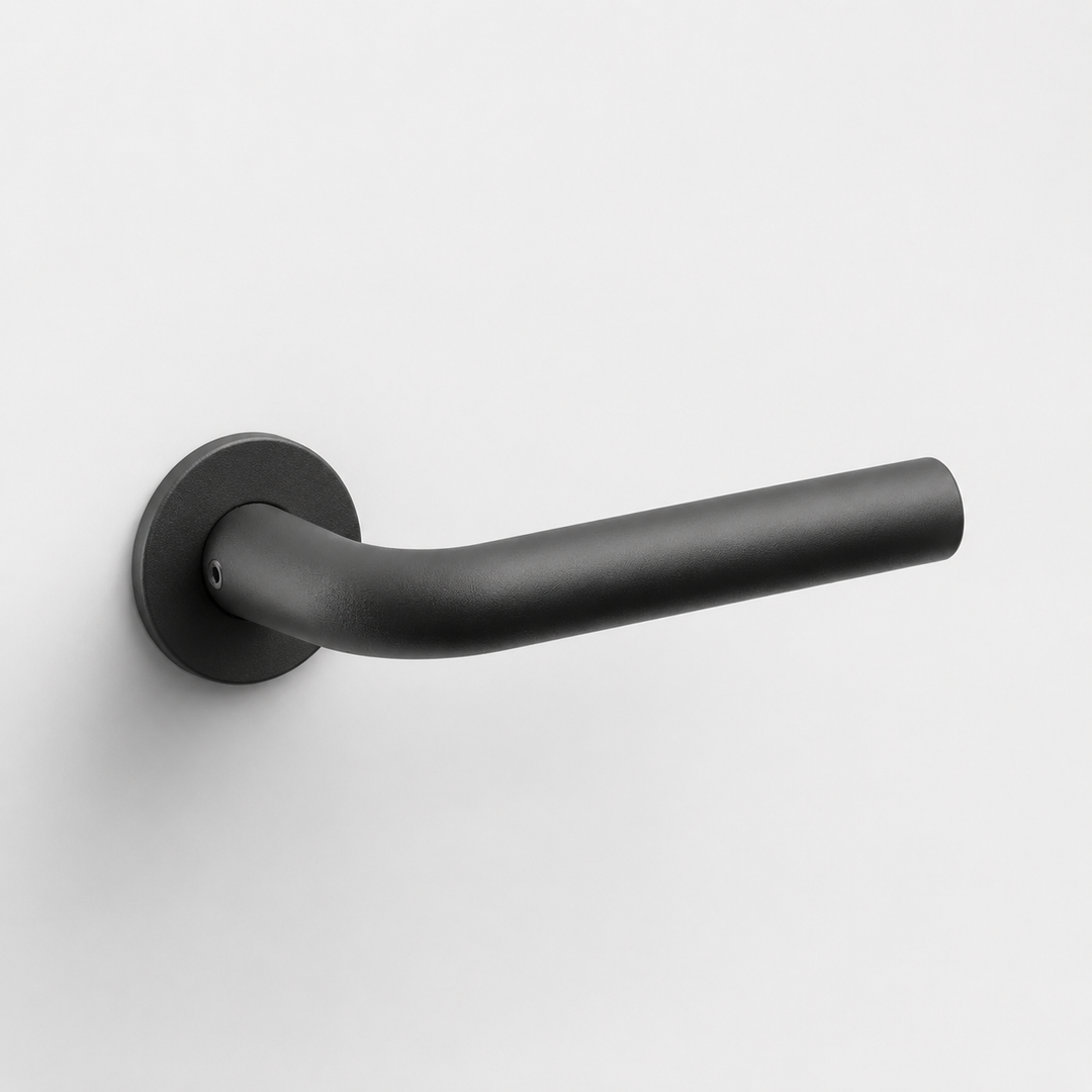 Matte black FSB 1075 architectural door lever with a curved L-shaped design on a circular rose against a white background.