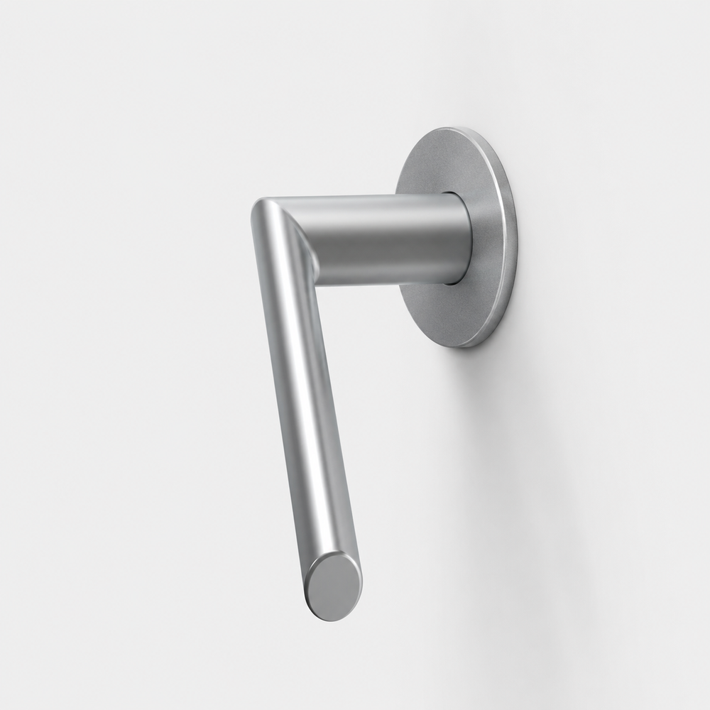 FSB 1108 matte silver door lever with a round neck and ergonomic mitred grip on a circular rose against a white wall.