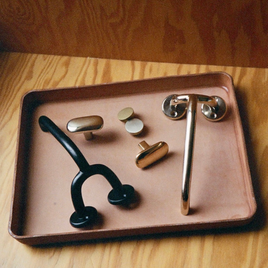 Maha Alavi Fauna hardware on a tray in mixed finishes.