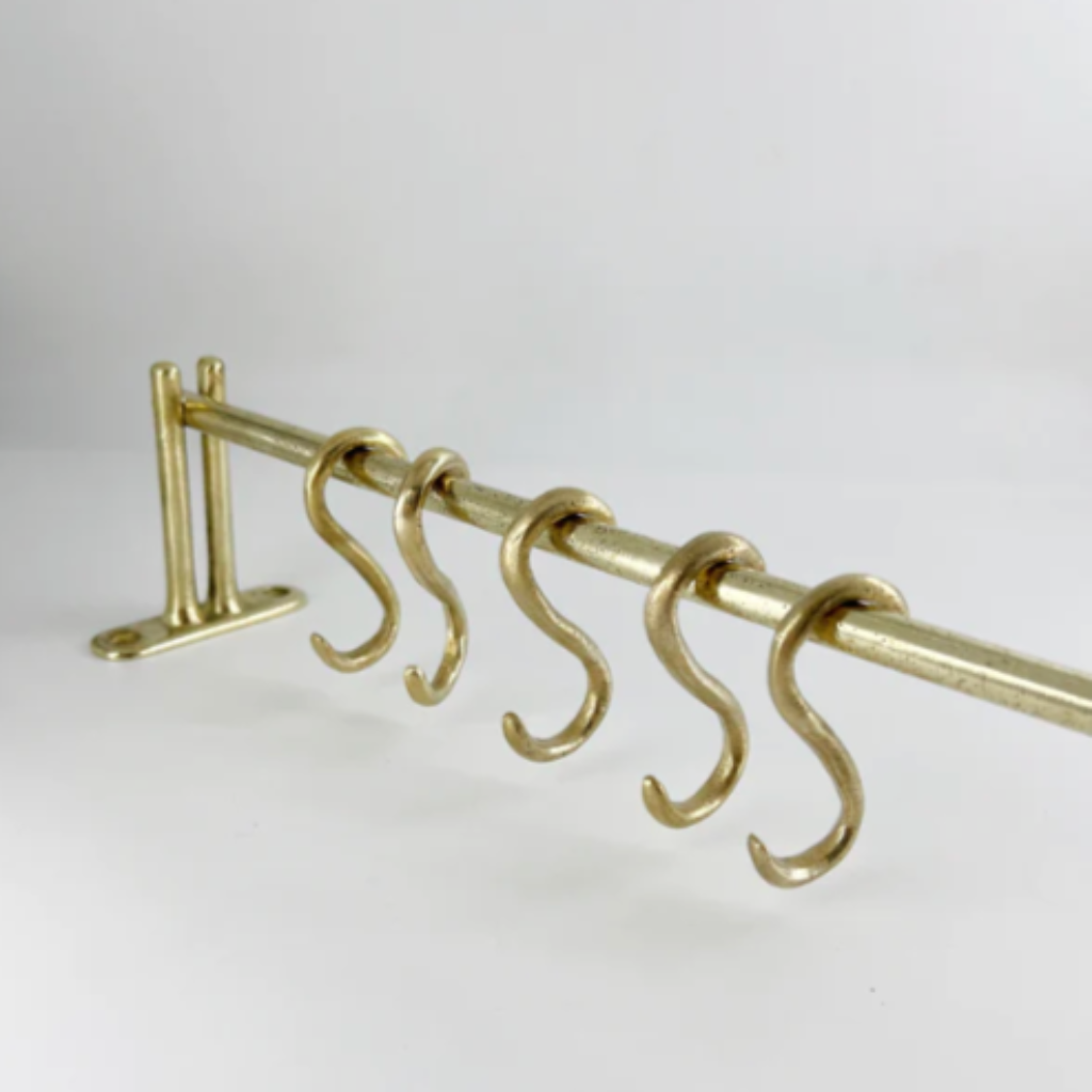 A set of four Mi & Gei Forme No. 1 Hanging Rail metal hooks on a white background.