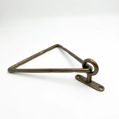 A Mi & Gei Forme No. 14 Triangle Towel Ring on a white surface.