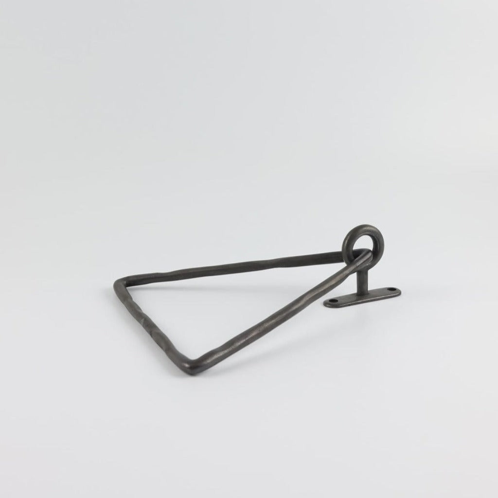 A Mi & Gei Forme No. 14 Triangle Towel Ring on a white surface.
