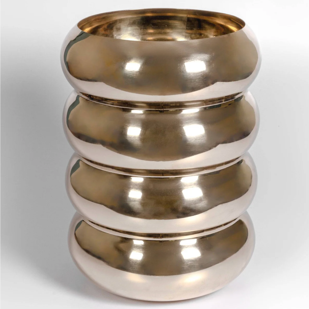 Elevate your space with the Mi & Gei Forme 34 solid brass waste basket, featuring a sculptural design with soft curves for refined modern interiors.