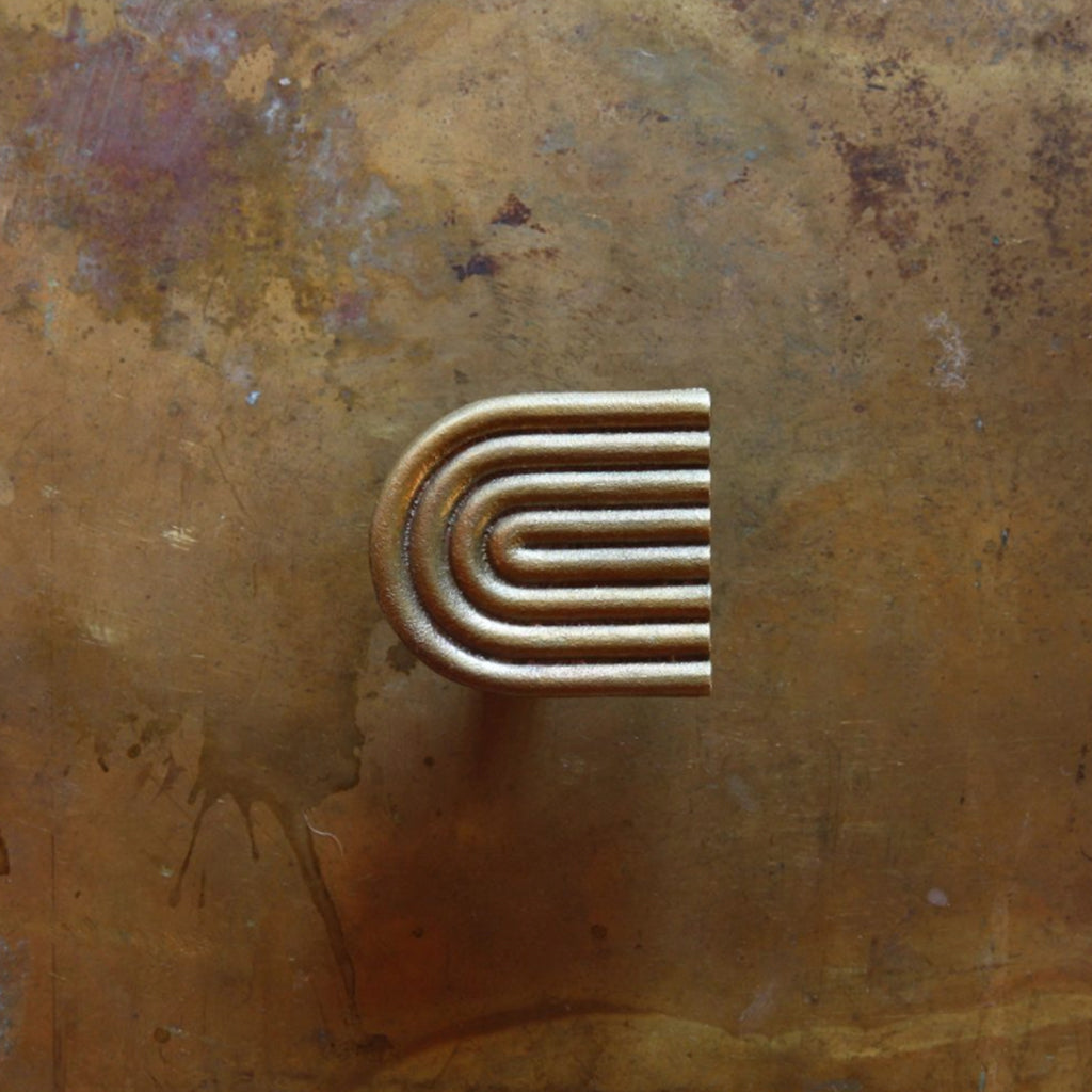 A close up of the Mi & Gei Libre Forme No. 9 Hook on a wall.