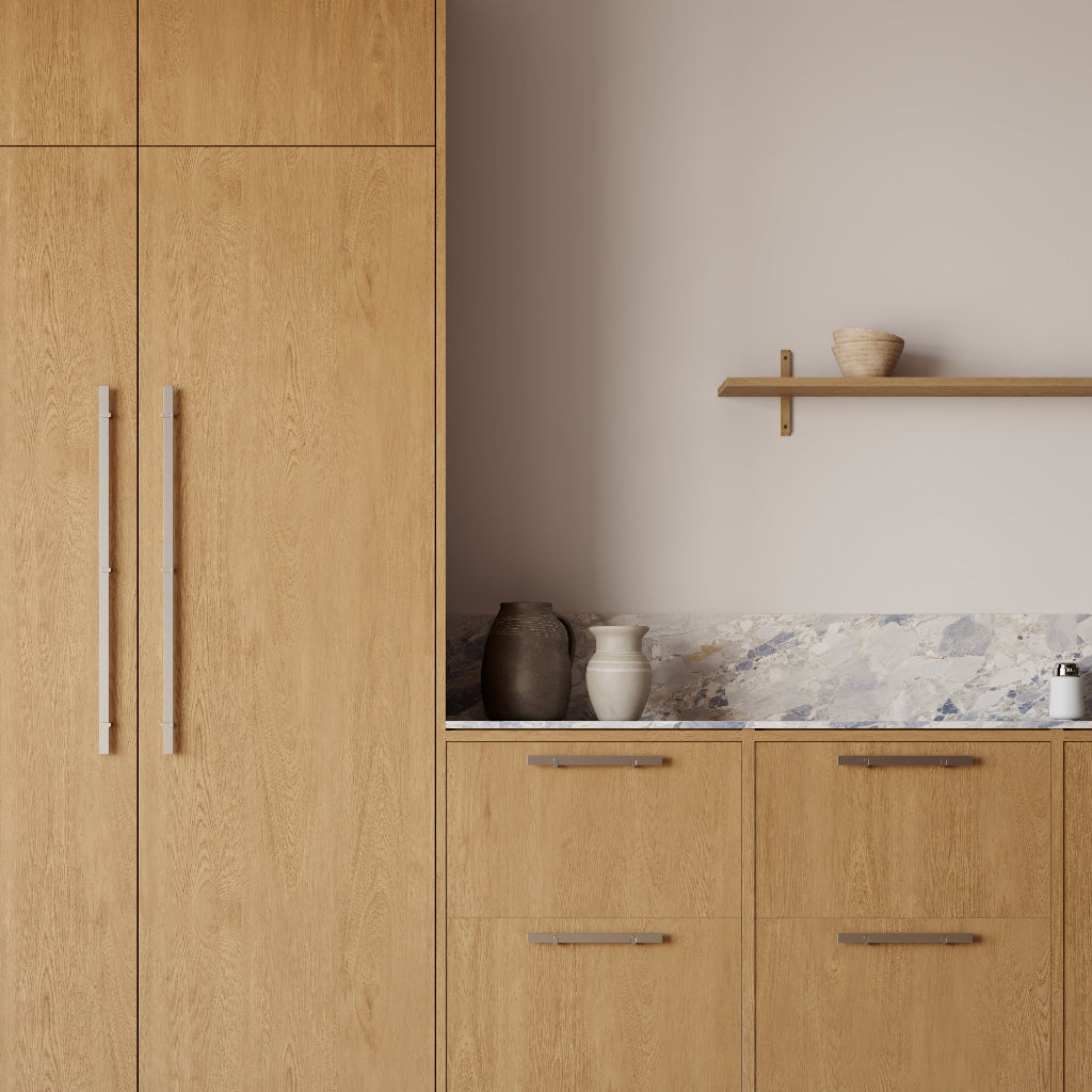 Wood kitchen cabinetry with slim brushed metal cabinet pulls
