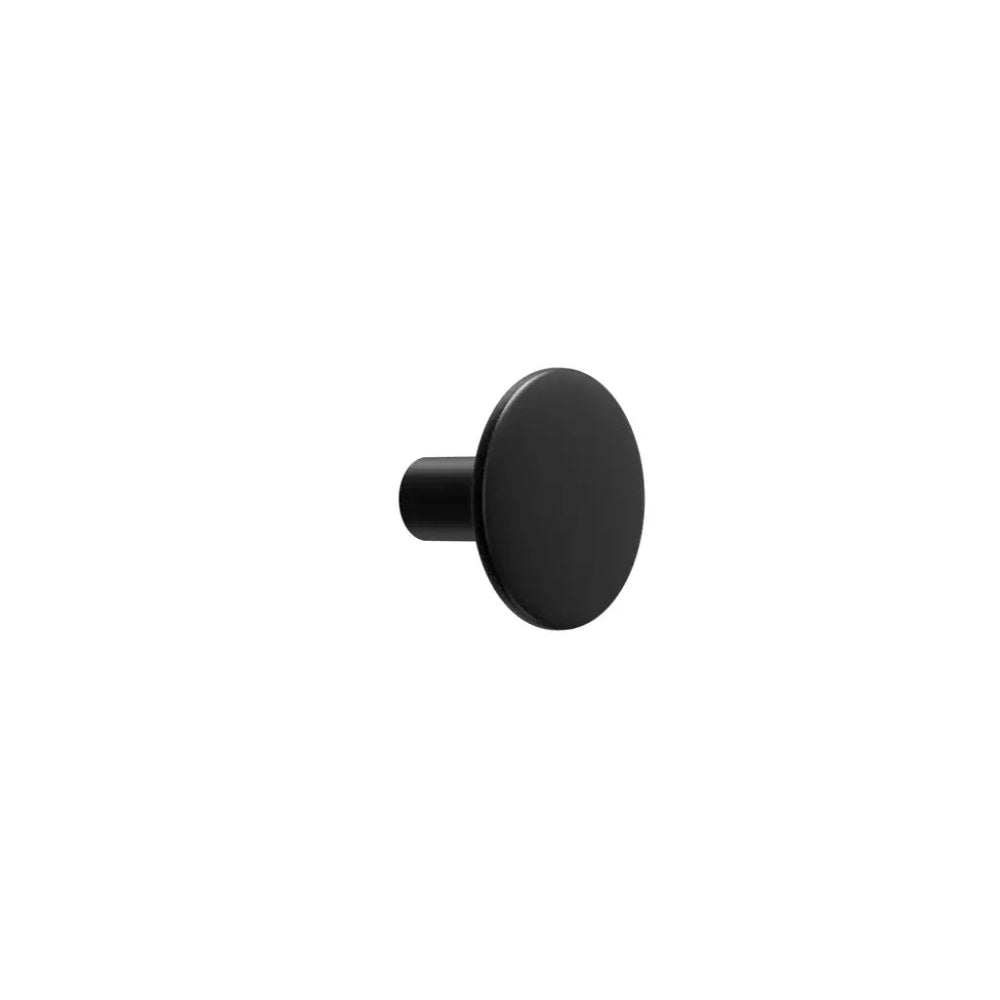 Black circular cabinet knob on white background
